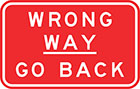 red sign with white text, wrong way &mdash; go back