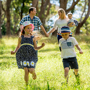 Young family walking in a park