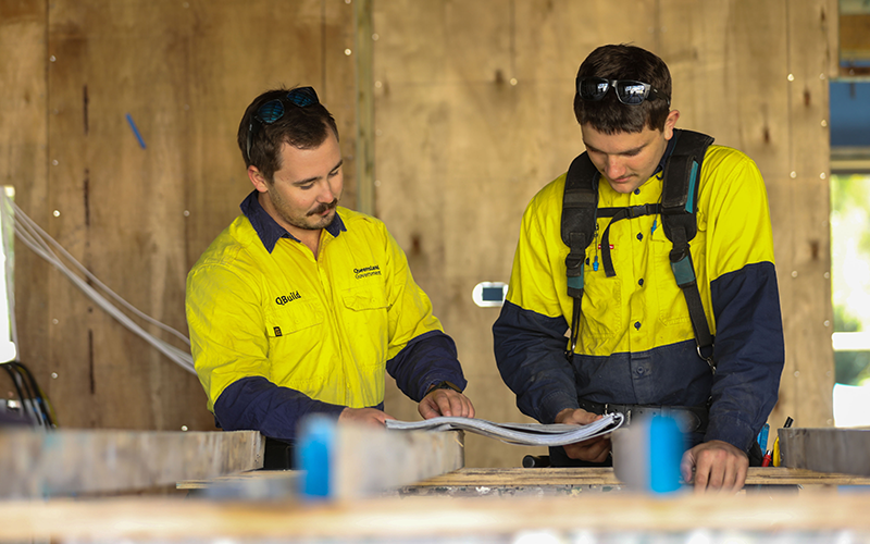 photo of contractors in high vis working on a site