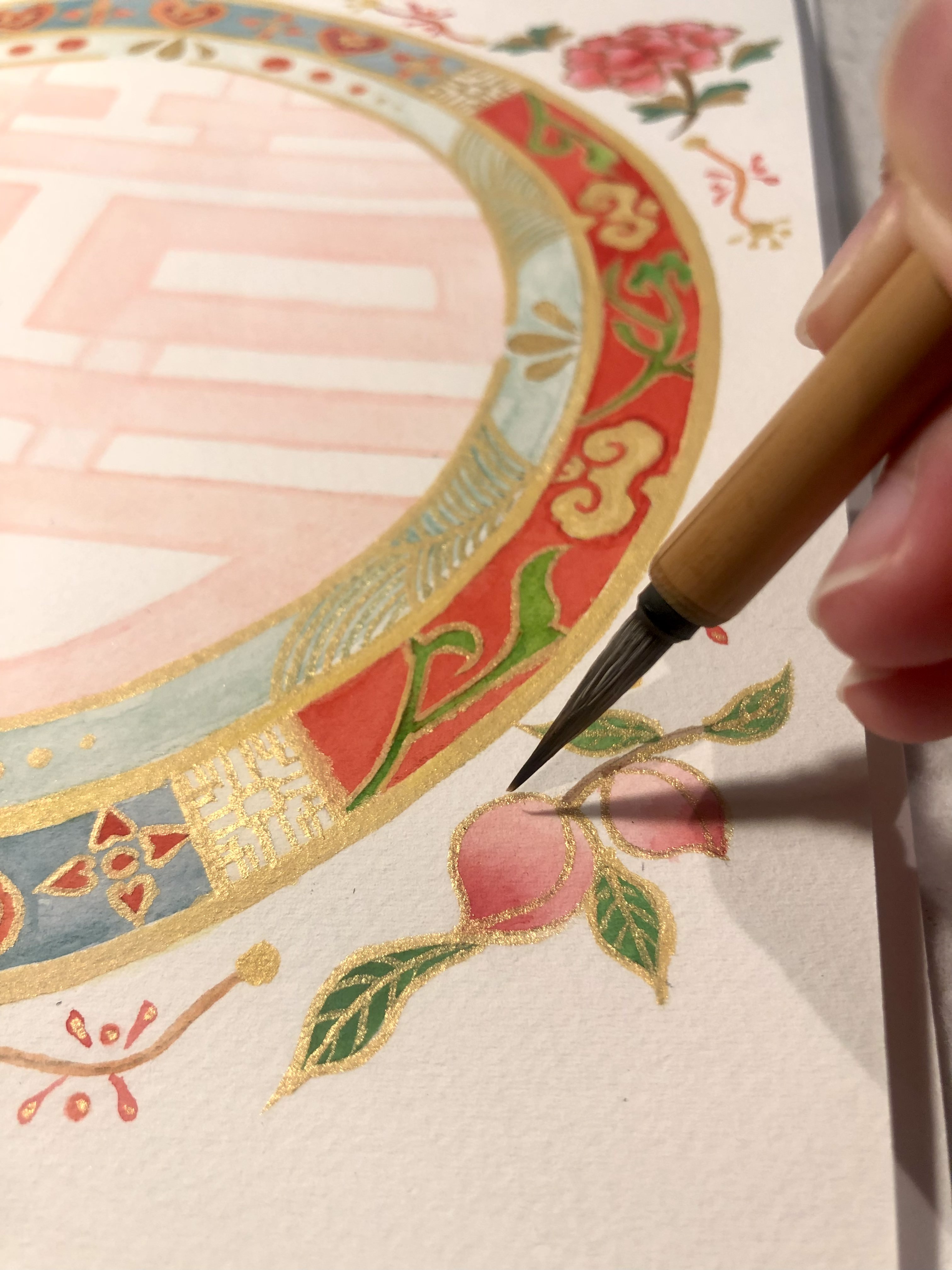 Artist Silka Huang working on the peach element of the design.